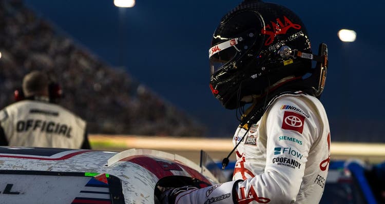 Christopher Bell climbs from his No. 20 car after a NASCAR Cup Series race at Chicagoland.