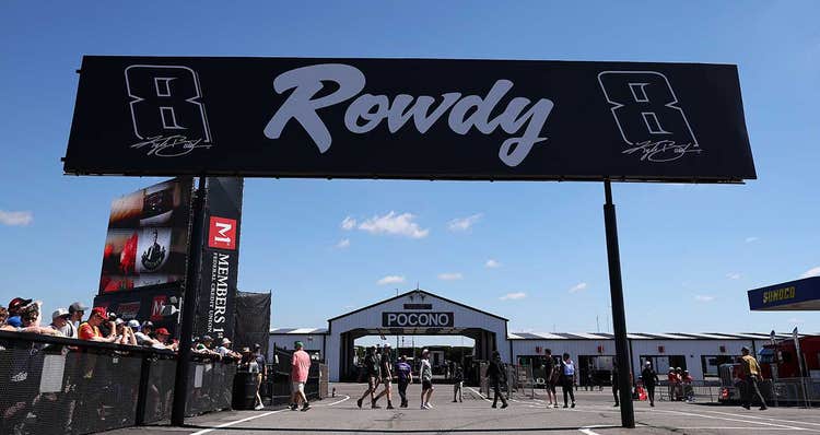 Kyle Busch's legacy is remembered on a billboard near the Cup Series garage at Pocono Raceway